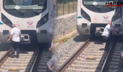 Raylara düşen kediyi kurtarmak için treni durdurdu, raylara indi